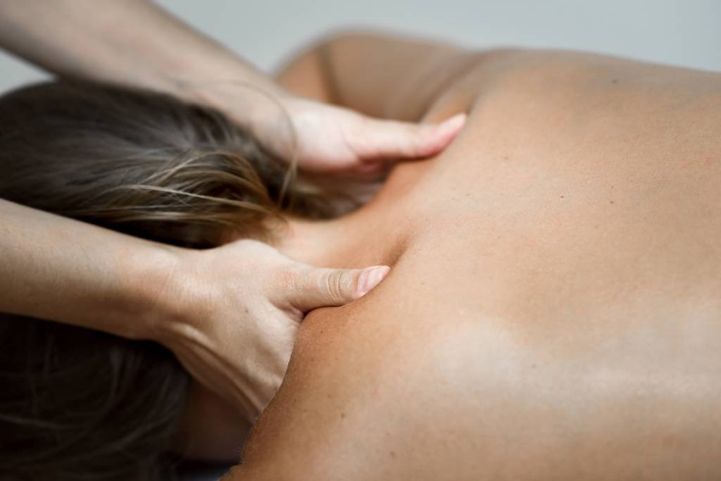 young-woman-receiving-back-massage-spa-center